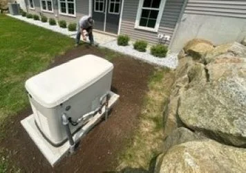 Residential Generac installation in progress, technician on site