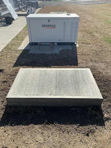 Commercial Generac unit on freshly poured concrete pad