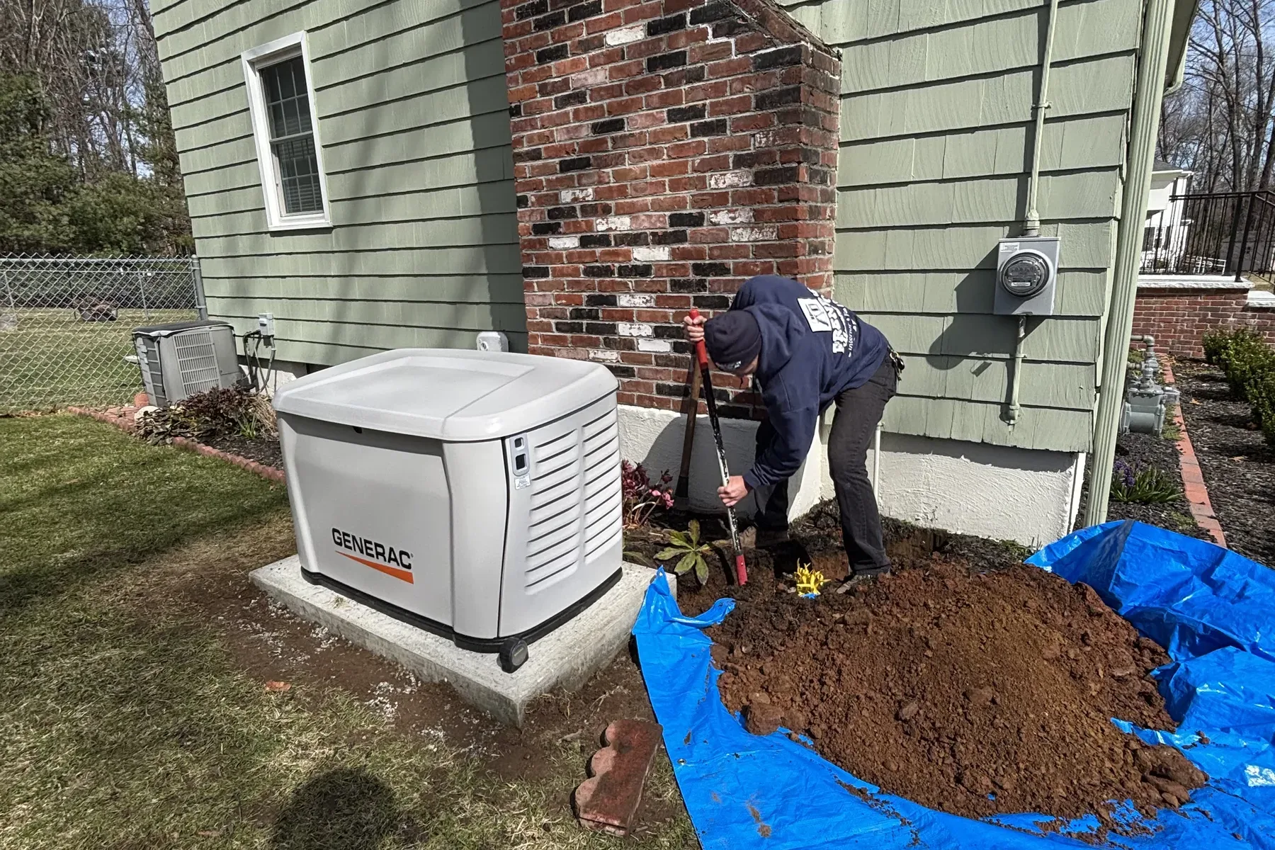 Residential Generac install with landscaping